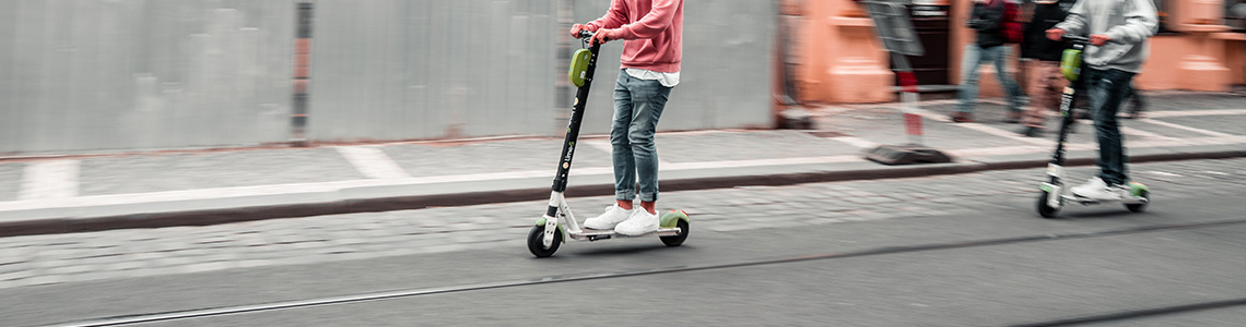 [Photo: E-Scooter in urban environment]